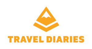 Logo of Travel Diaries featuring a stylized mountain icon and the text 'TRAVEL DIARIES' in bold orange letters.